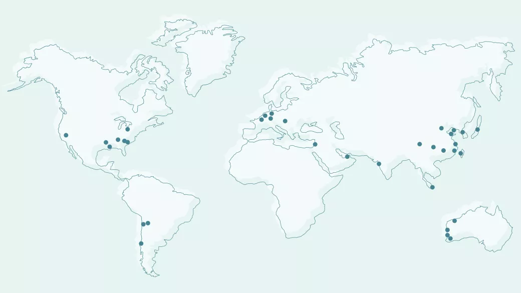 World map in light blue tones showing Albemarle locations marked with black dots across North and South America, Europe, Africa, and parts of Asia and Australia.