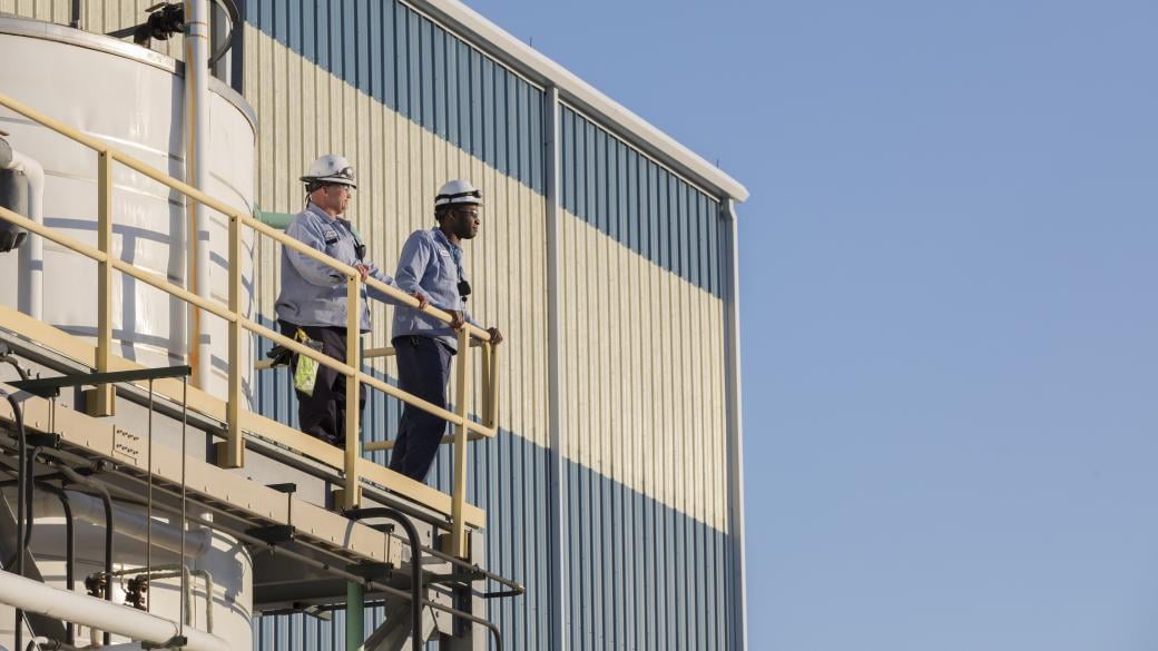 workers at processing plant