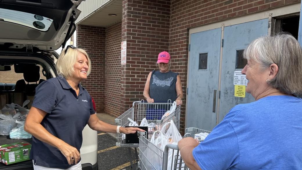 volunteers loading up supplies in vehicle