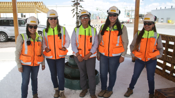 photo of female workers in hardhats 