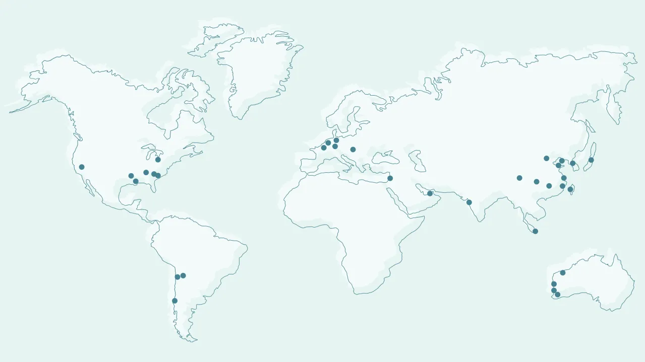 World map in light blue tones showing Albemarle locations marked with black dots across North and South America, Europe, Africa, and parts of Asia and Australia.