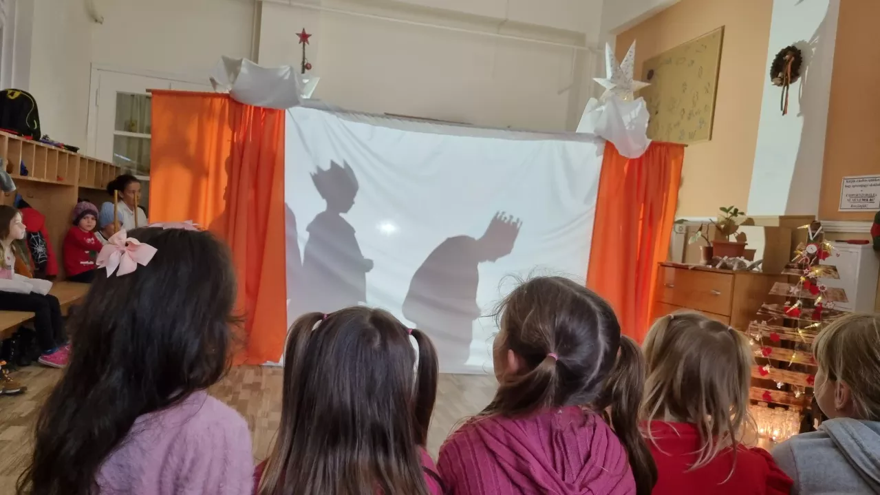 Children watching a play with other children in costume.
