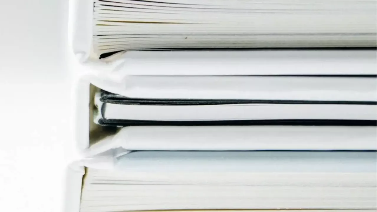 Stacked notebooks. 