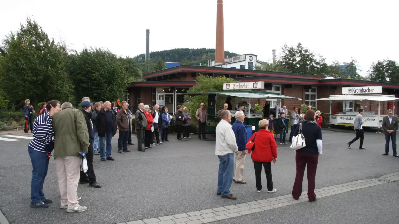 People outside at neighborhood event. 