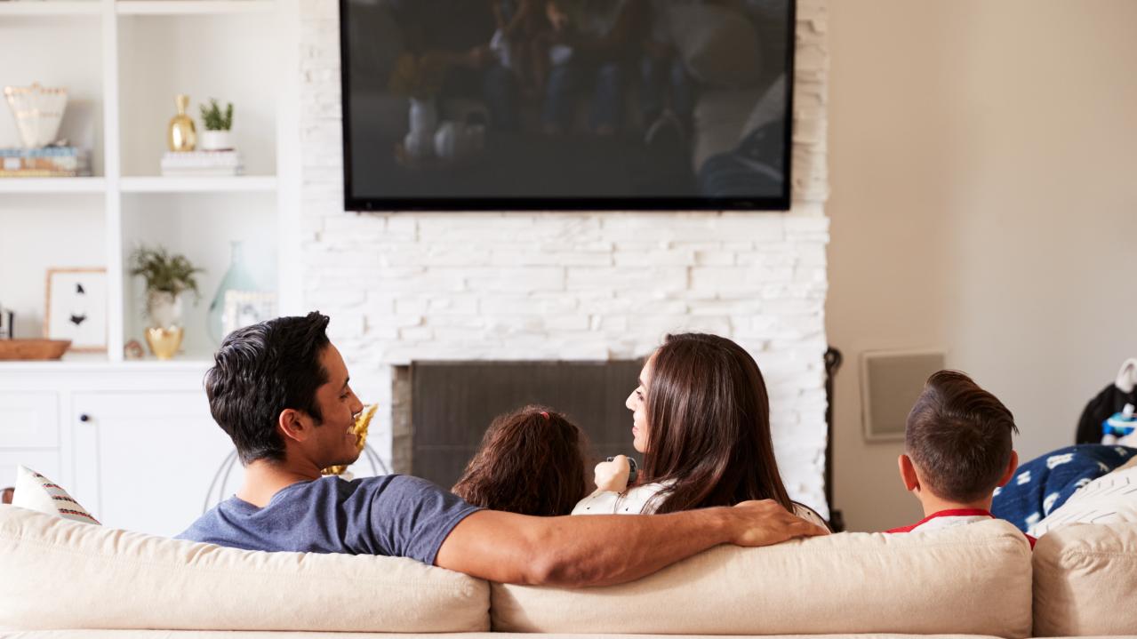 picture of family sitting on a couch