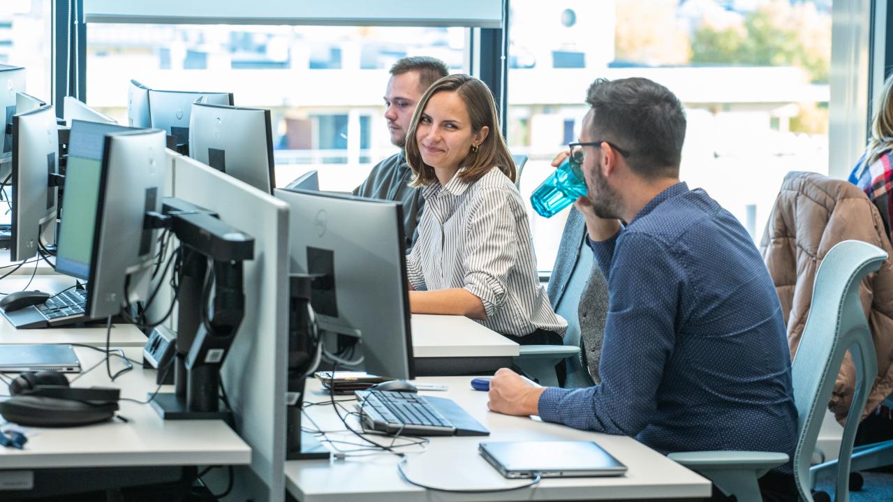 A photo of two people working together in the office