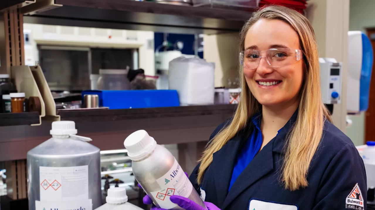 A photo of a female chemist at Albemarle