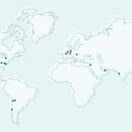World map in light blue tones showing Albemarle locations marked with black dots across North and South America, Europe, Africa, and parts of Asia and Australia.