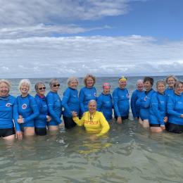 A Team Photo of the Binningup SLSC Silver Salties in the Water