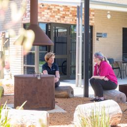 A Photo of Two Women in a Yarning Circle in Australia