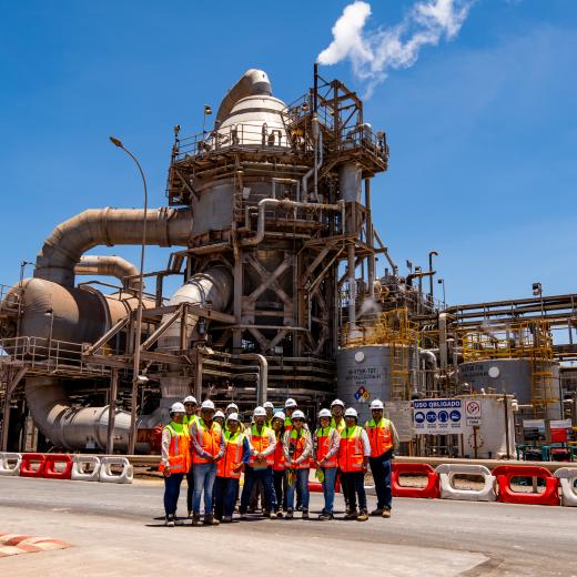 A photo of Albemarle employees in front of a plant in Chile